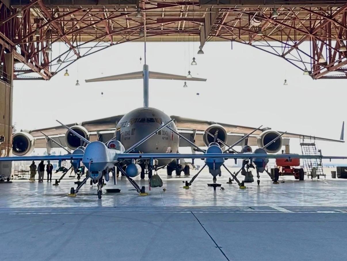 Manned and unmanned aircraft in hangar